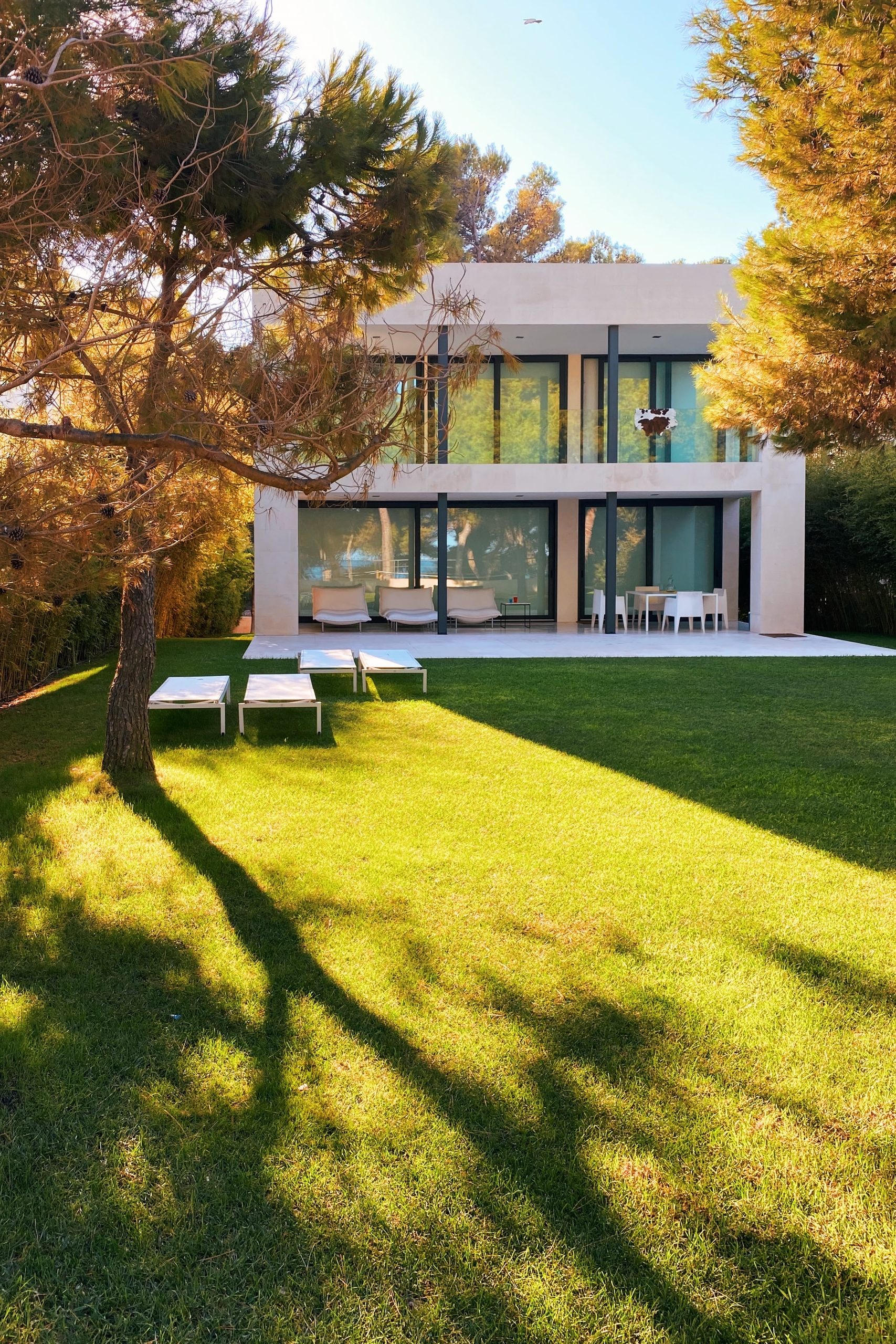 white and brown concrete building near green grass field during daytime